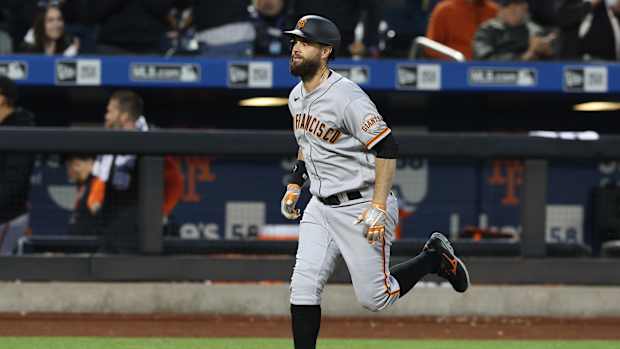 Brandon Belt rounds the bases.